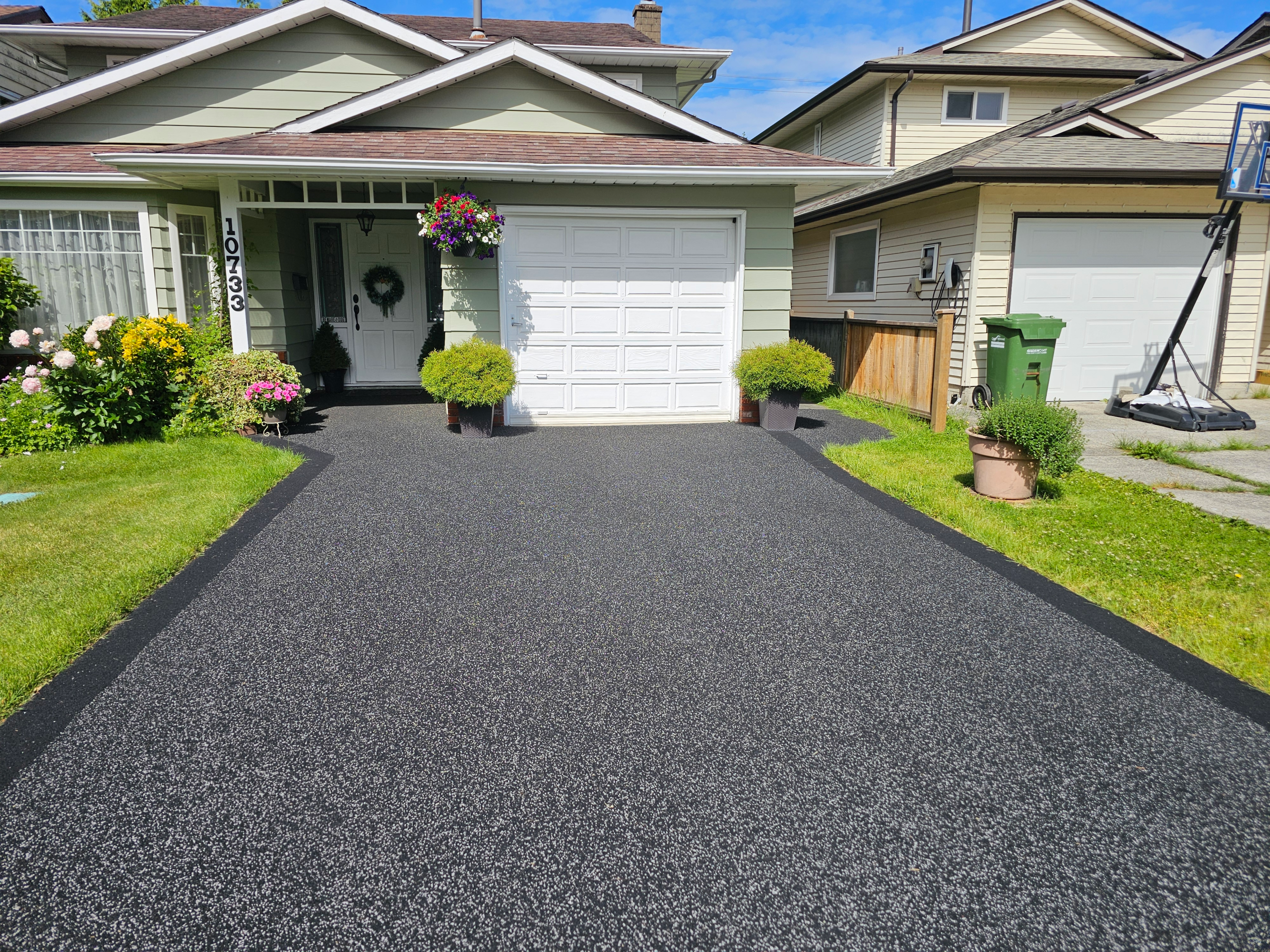 black rubber paved driveway with border, Richmond, BC