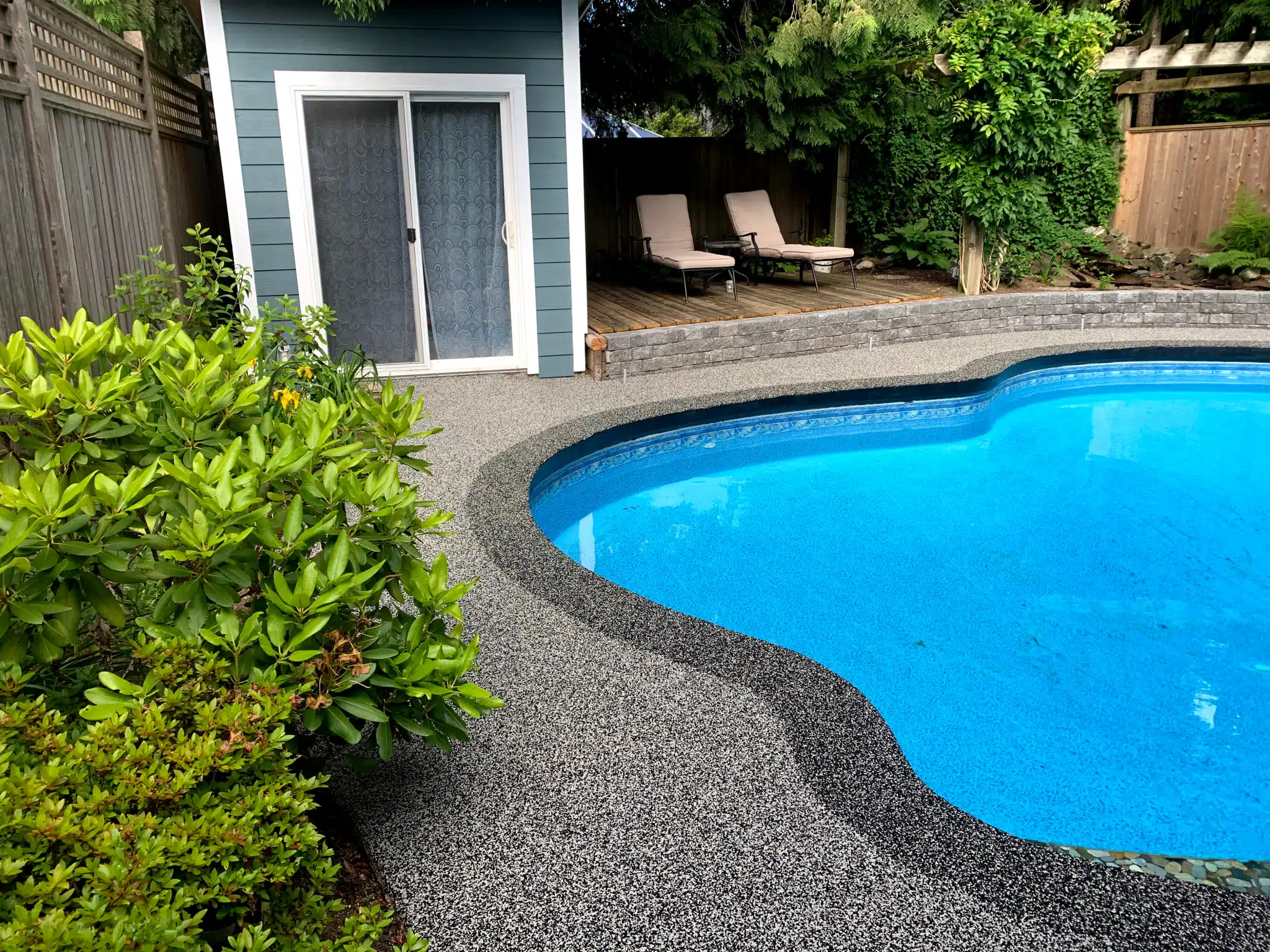 rubber paved pool deck with custom coping, Surrey, BC
